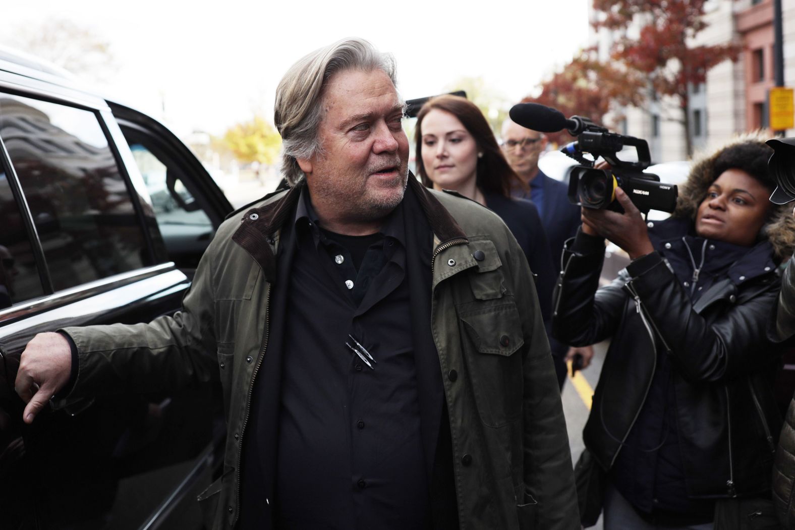Bannon speaks to the press after he testified in the trial of Roger Stone in November 2019.