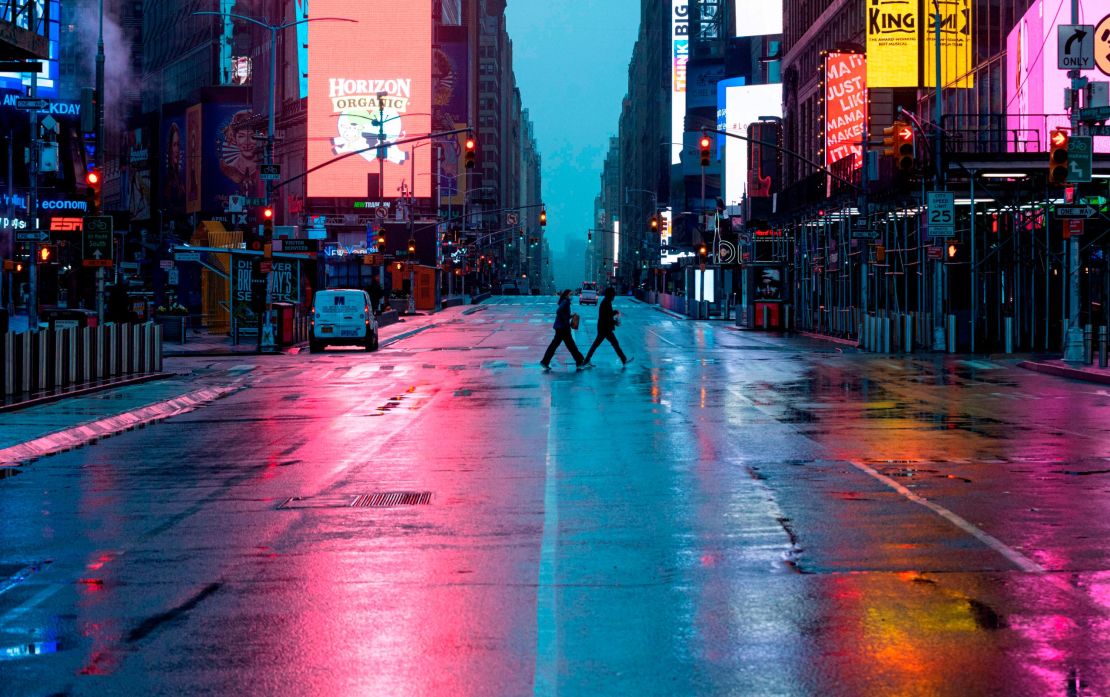 An almost deserted Times Square looks markedly different than the bustling area pre-Covid-19.