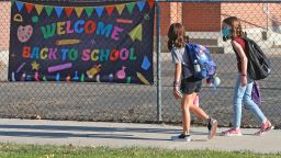 Students arrive at Liberty Elementary School during the first day of class Monday, Aug. 17, 2020, in Murray, Utah. Murray City School District opened its doors Monday offering its 6,300 students a choice among in-person learning, hybrid instruction and distance learning.