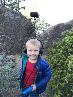 Gordon Hempton's grandson, Obi, tunes in to the sounds of nature around Lake Tahoe.