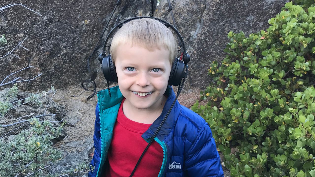 Gordon Hempton's grandson, Obi, tunes in to the sounds of nature around Lake Tahoe.