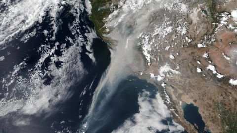 Smoke from the wildfires in California is seen stretching some 600 miles off the coast of California in a NASA satellite image dated August 19.