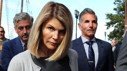 Lori Loughlin and her husband Mossimo Giannulli, right, leave the John Joseph Moakley United States Courthouse in Boston on Aug. 27, 2019. A judge says actress Lori Loughlin and her fashion designer husband, Mossimo Giannulli, can continue using a law firm that recently represented the University of Southern California. The couple appeared in Boston federal court on Tuesday to settle a dispute over their choice of lawyers in a sweeping college admissions bribery case. Prosecutors had said their lawyers pose a potential conflict of interest. Loughlin and Giannulli say the firms work for USC was unrelated to the admissions case and was handled by different lawyers. 