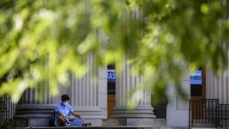CHAPEL HILL, NC - AUGUST 18: A student studies outside the closed Wilson Library on the campus of the University of North Carolina at Chapel Hill on August 18, 2020 in Chapel Hill, North Carolina. The school halted in-person classes and reverted back to online courses after a rise in the number of COVID-19 cases over the past week. (Photo by Melissa Sue Gerrits/Getty Images)