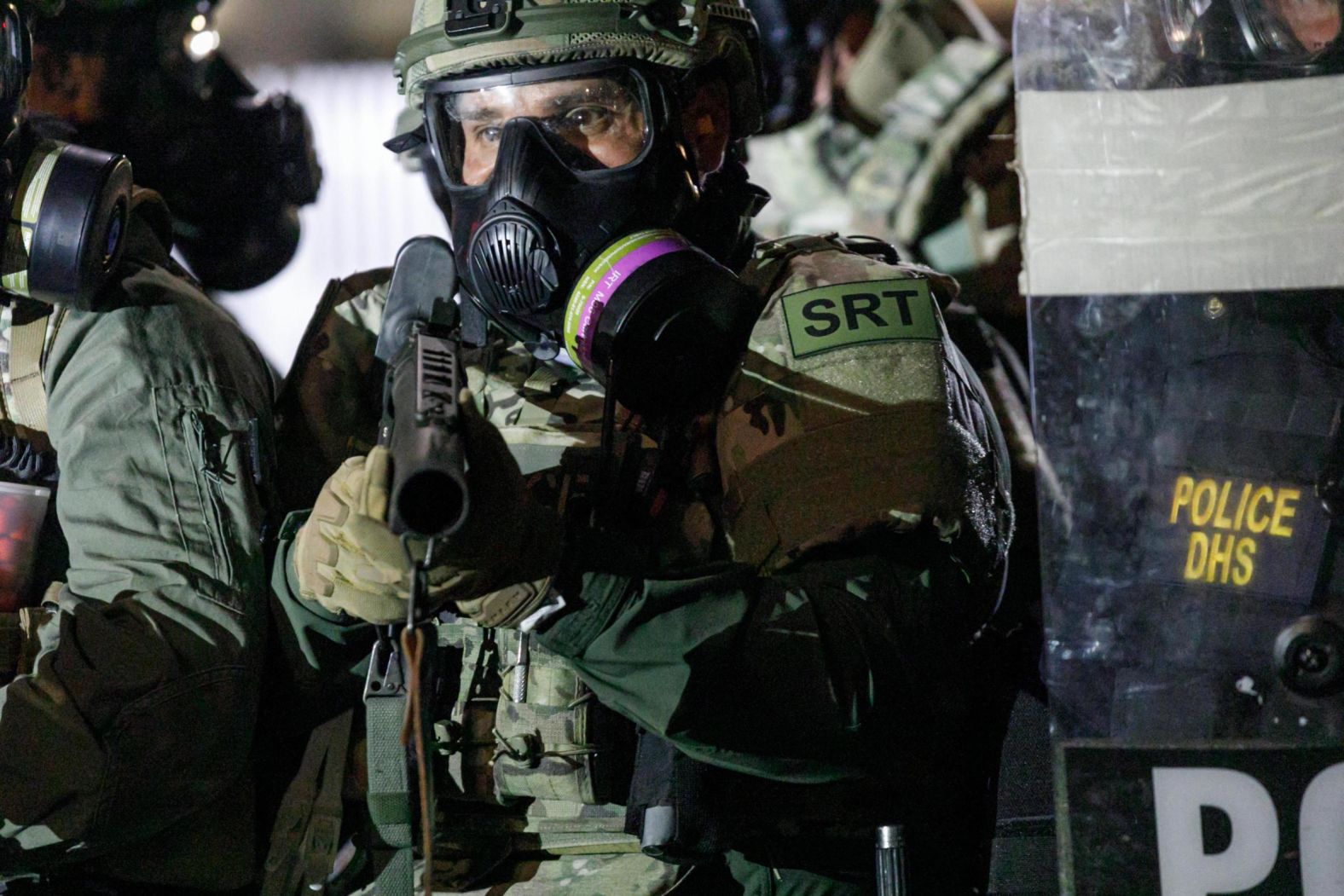 Federal officers are seen in the streets of Portland on August 19.