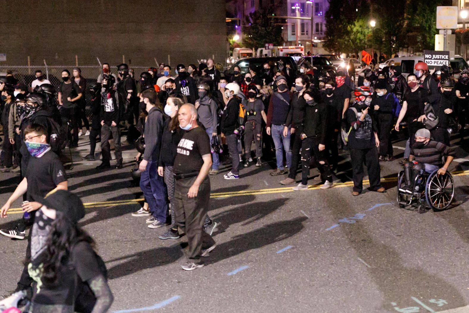 Demonstrators march to the ICE building on August 19.