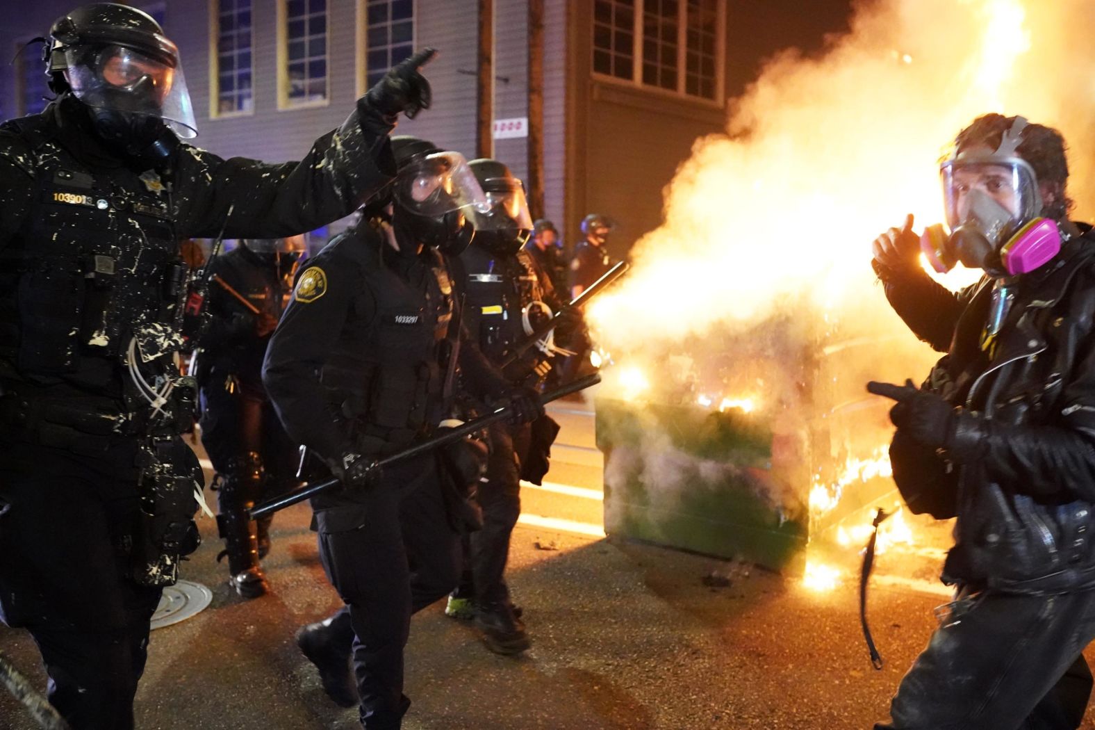 Police officers try to move protesters back on August 21.