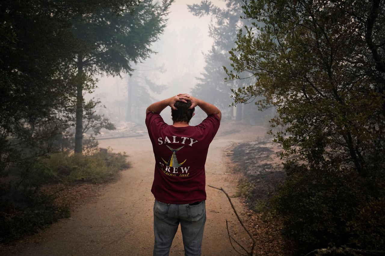 Peter Koleckar reacts after seeing multiple homes burned in his neighborhood in Bonny Doon, California, on August 20, 2020.