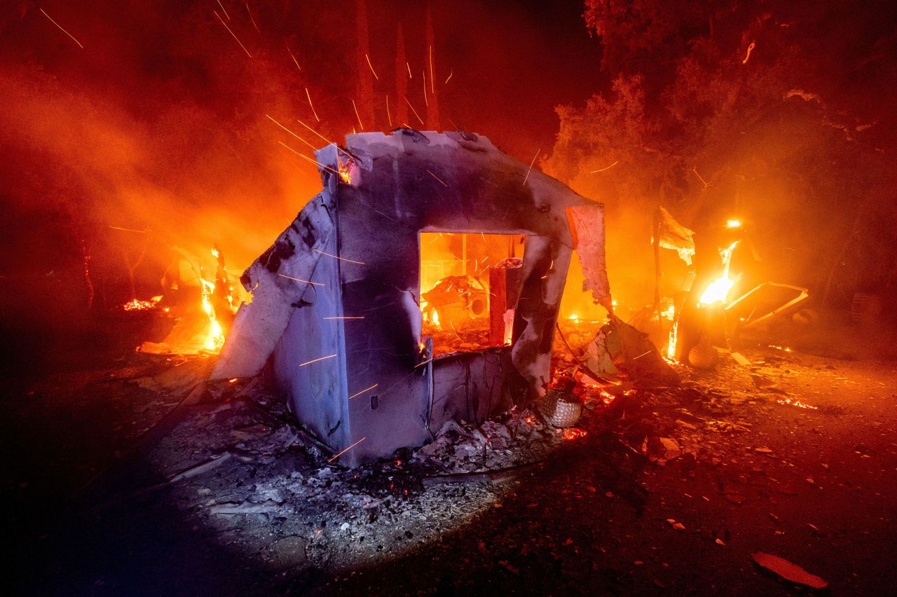 Flames consume a home in Napa County, California, on August 19, 2020.