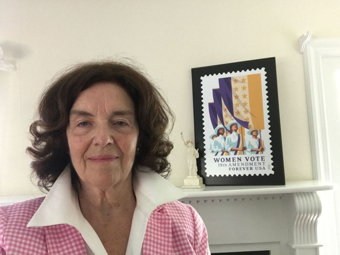 Coline Jenkins with the new USPS stamp in honor of the 19th Amendment.