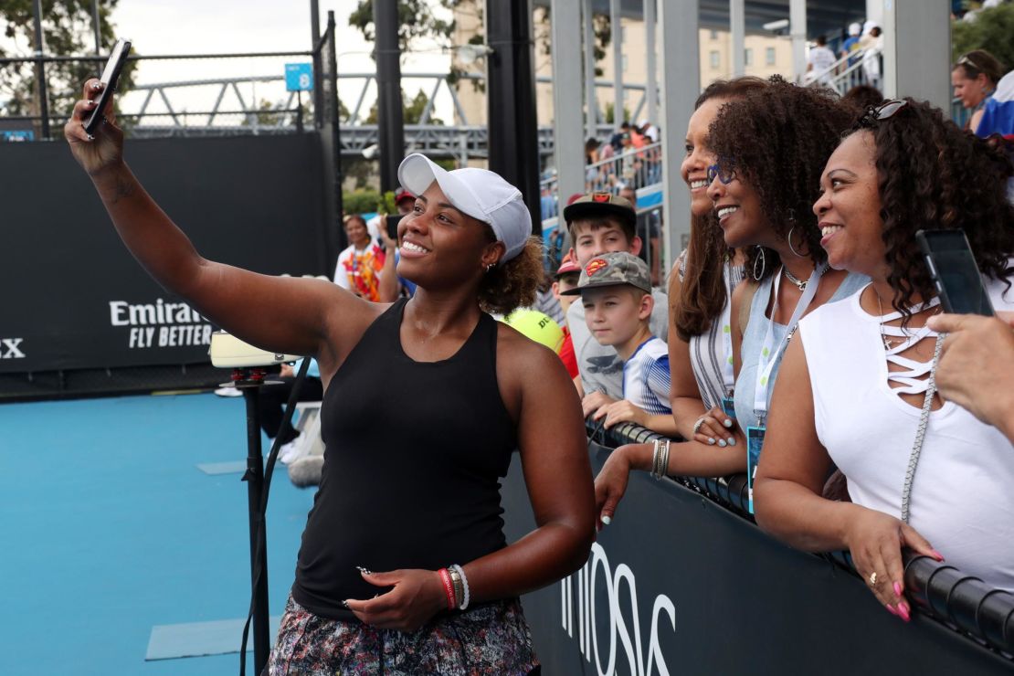Taylor Townsend poses for a photo with spectators during this year's Australian Open