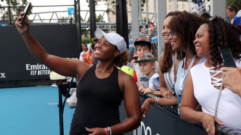 Taylor Townsend poses for a photo with spectators during this year's Australian Open