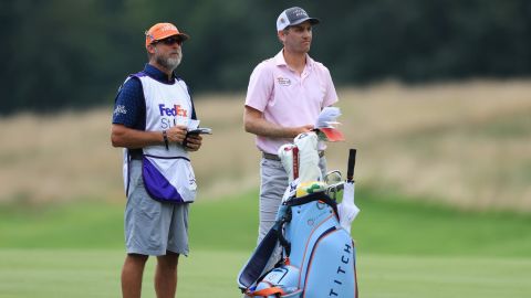Todd talks with his caddie on the seventh hole during the final round of the World Golf Championship-FedEx St Jude Invitational.