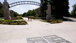 "Protect Purdue" stickers are placed near the Gateway to the Future Arch, Friday, Aug. 7, 2020 in West Lafayette.