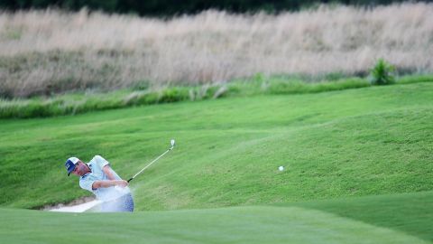 Todd hits his second shot from a fairway bunker on the seventh hole during the first round of the World Golf Championship-FedEx St. Jude Invitational.