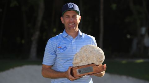 Todd celebrates with the trophy after winning the Mayakoba Golf Classic at El Camaleon Mayakoba Golf Course.