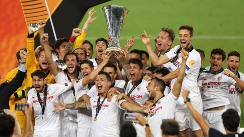 Sevilla's players celebrate after winning the Europa League final over Inter Milan in Cologne, Germany, on Friday, August 21.