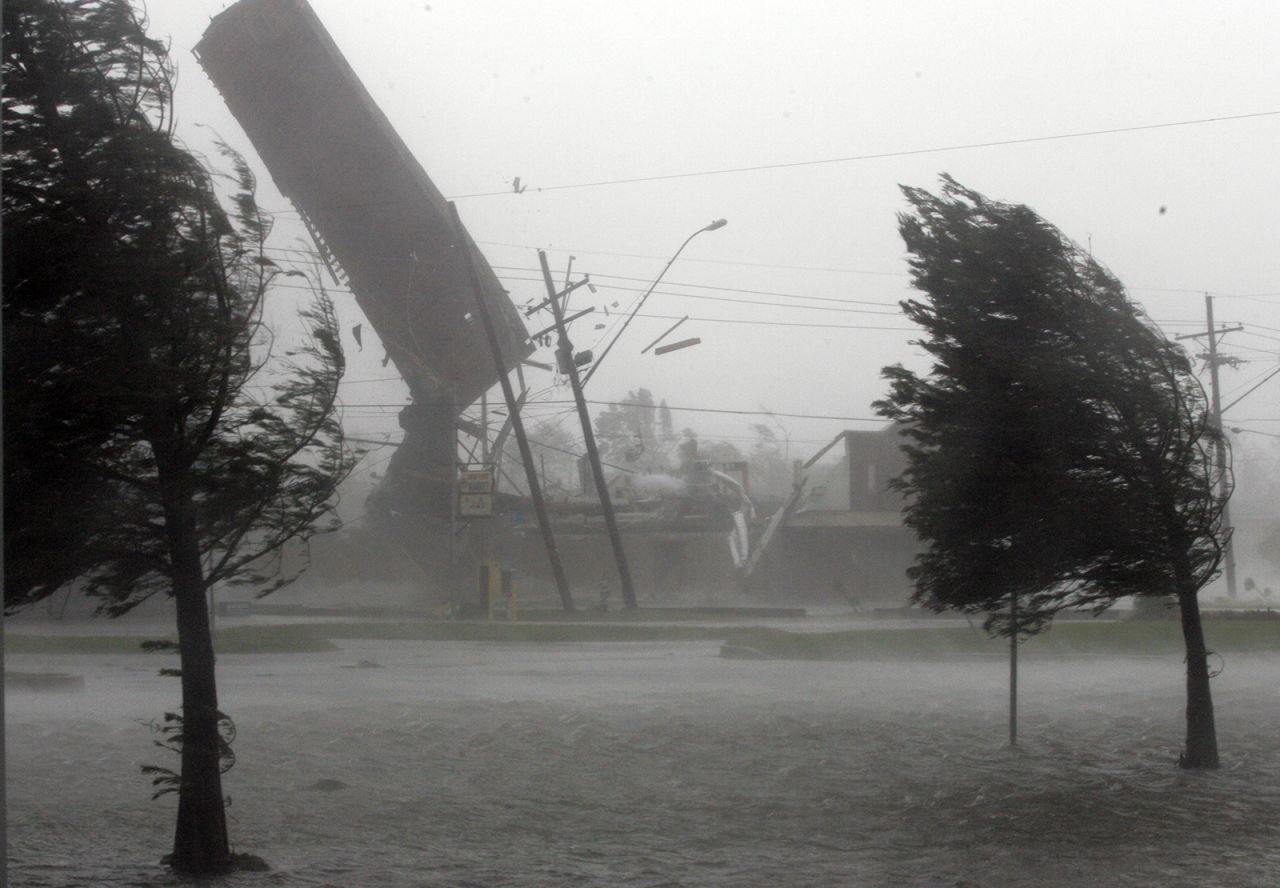 Strong winds blow the roof off the Backyard Barbeque restaurant in Kenner, Louisiana, as Katrina makes landfall on August 29, 2005.