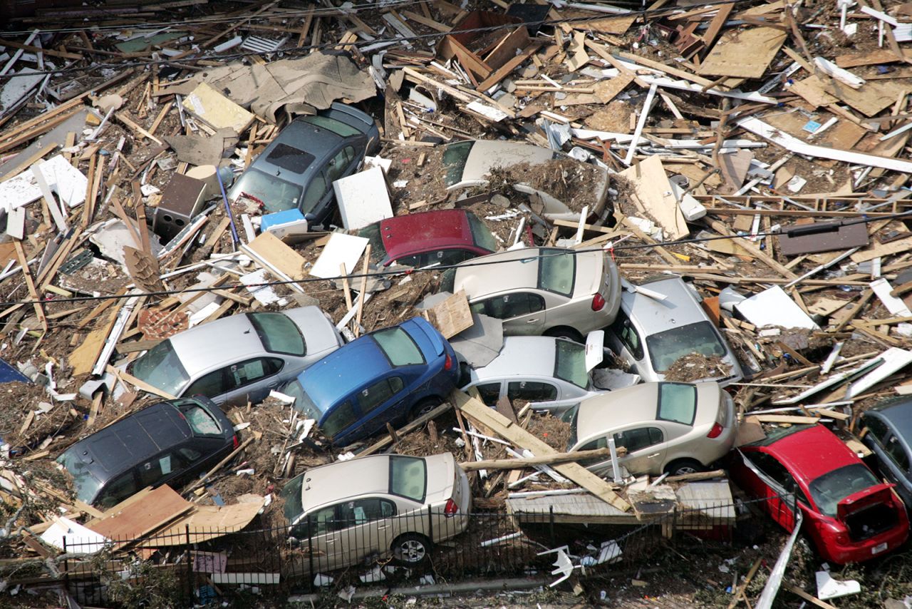 Cars are piled up in debris in Gulfport, Mississippi.