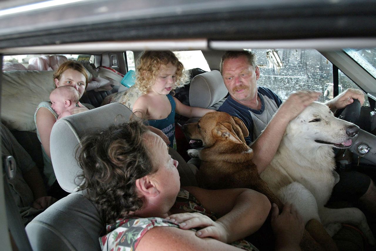 The Stump family stays in their car in Biloxi, Mississippi, after their home was destroyed by Katrina.