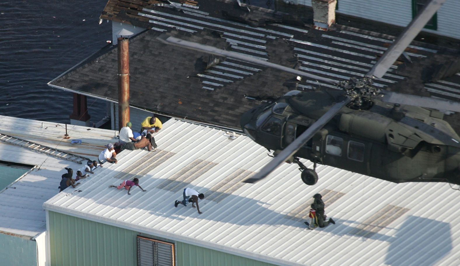 New Orleans residents are rescued by a helicopter on August 31, 2005, two days after Katrina made landfall.