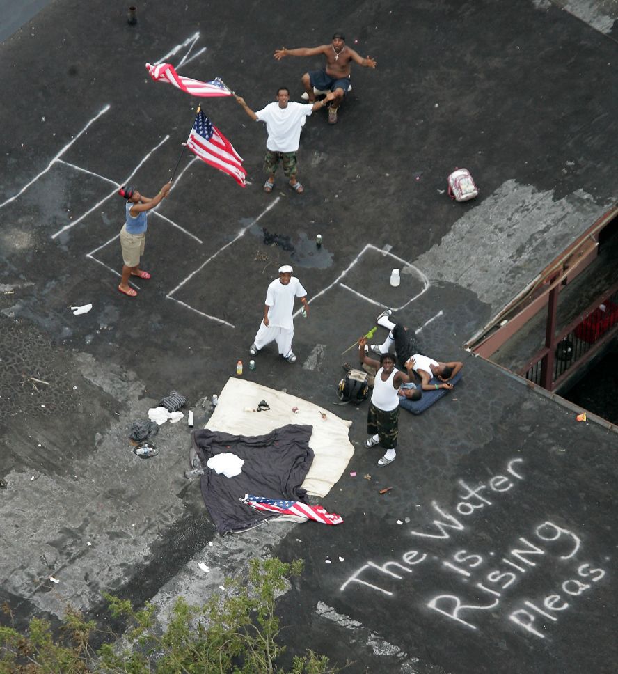 Residents wait to be rescued from a rooftop in New Orleans on September 1, 2005.