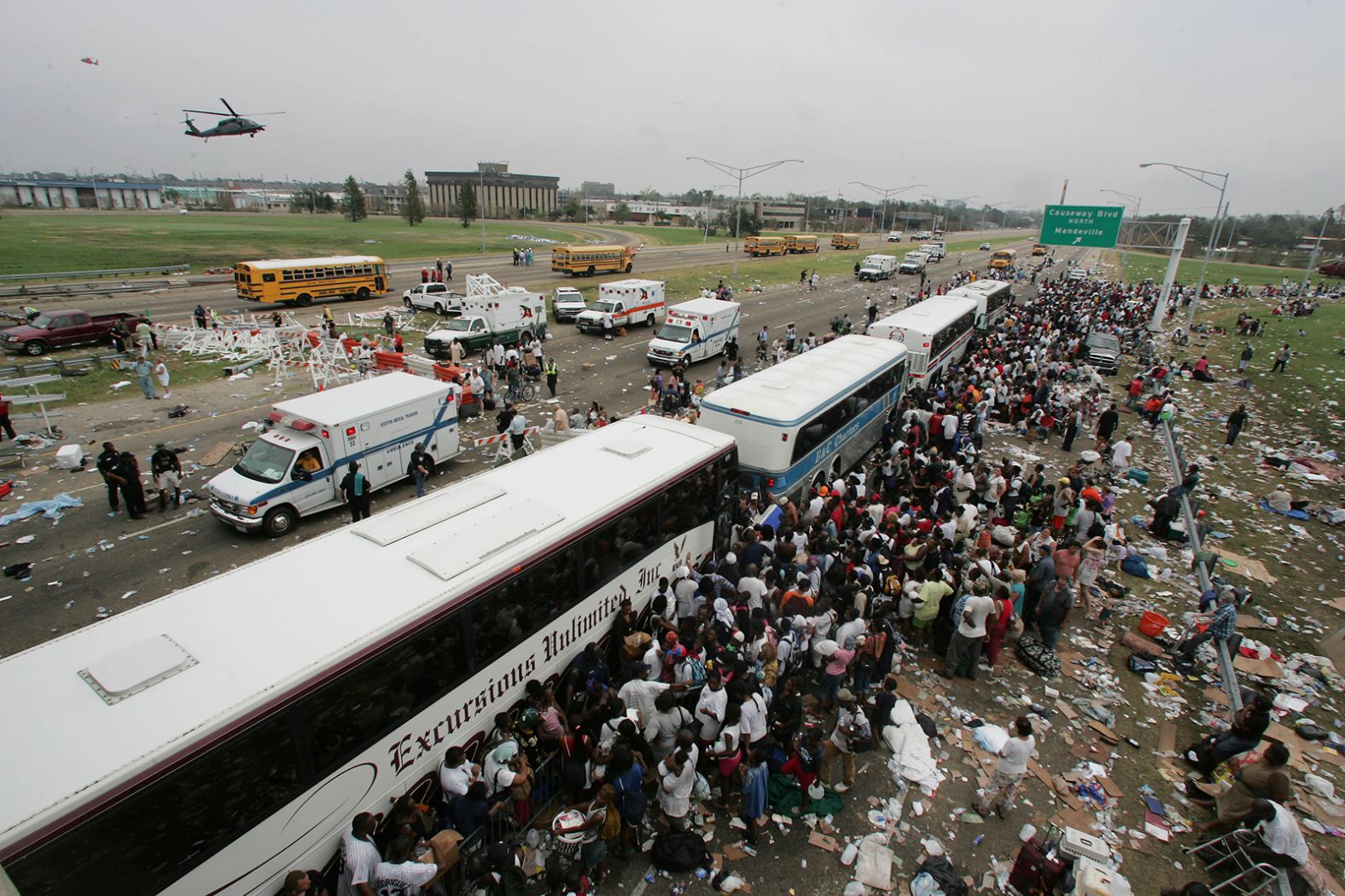 Thousands of New Orleans residents gather at a evacuation staging area along Interstate 10 in Metairie, Louisiana.