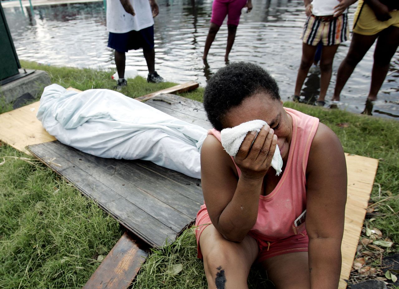 Evelyn Turner cries alongside the body of her longtime companion, Xavier Bowie, after he died in New Orleans. Turner and Bowie decided to ride out Hurricane Katrina when they could not find a way to leave the city. Bowie, who had lung cancer, died when he ran out of oxygen. He was 57.