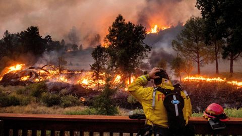 A firefighter watches the LNU Lightning Complex fires spread through the Berryessa Estates neighborhood in Napa County on August 21.