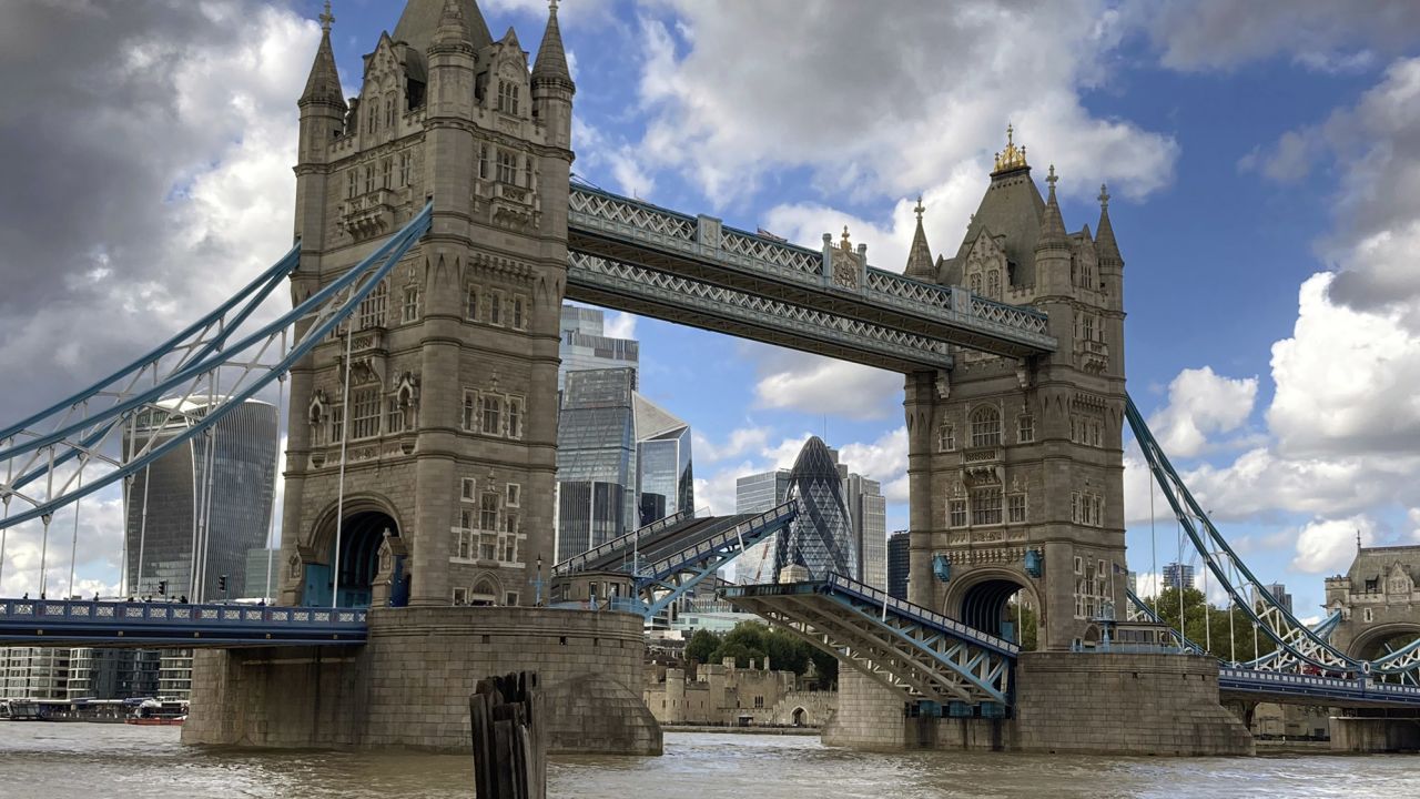 Tower Bridge crossing the River Thames is seen stuck open, leaving traffic in chaos and onlookers stunned.