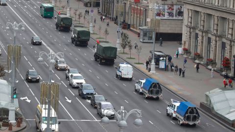 A convoy of police vehicles drives down the street ahead of another scheduled protest in Minsk on Sunday.