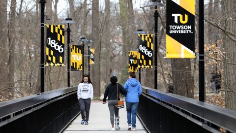 Towson University students walk on campus as the school shut down on March 11, 2020 in Towson, Maryland.