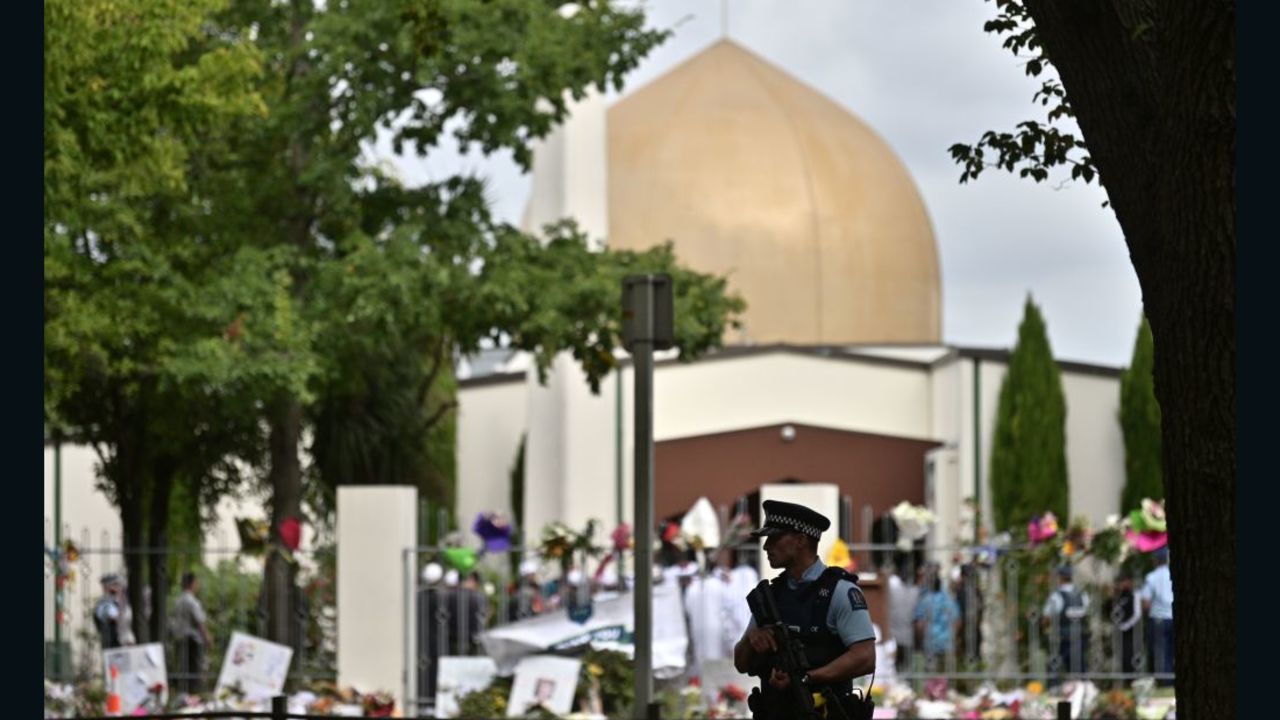A policeman patrols as delegates and religious leaders wait to enter Al Noor Mosque in Christchurch on March 23, 2019.