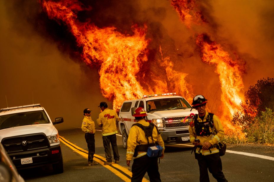 Flames from the LNU Lightning Complex fires leap above Butts Canyon Road in Lake County on August 23, 2020.