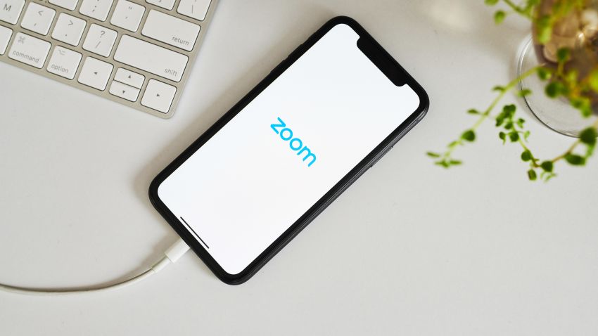 The logo for the Zoom Video Communications Inc. application is displayed on an Apple Inc. iPhone in an arranged photograph taken in the Brooklyn borough of New York, U.S., on Friday, April 10, 2020. Zoom's shares have soared in 2020 as the popularity of its video conferencing service has grown during a time of widespread lockdowns aimed at stemming the spread of the coronavirus pandemic. Photographer: Gabby Jones/Bloomberg via Getty Images