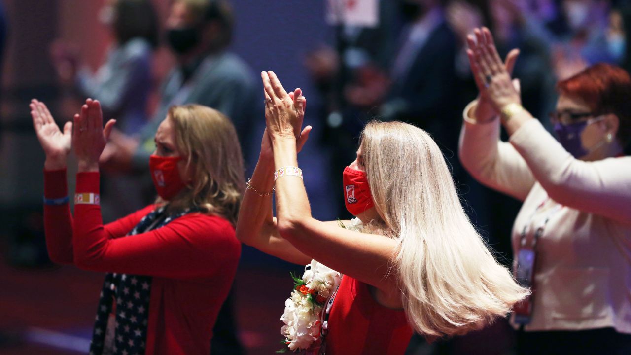 Delegates appalud at the beginning of the first day of the Republican National Convention, Monday, Aug. 24, 2020, in Charlotte, N.C.  (Travis Dove/The New York Times via AP, Pool)