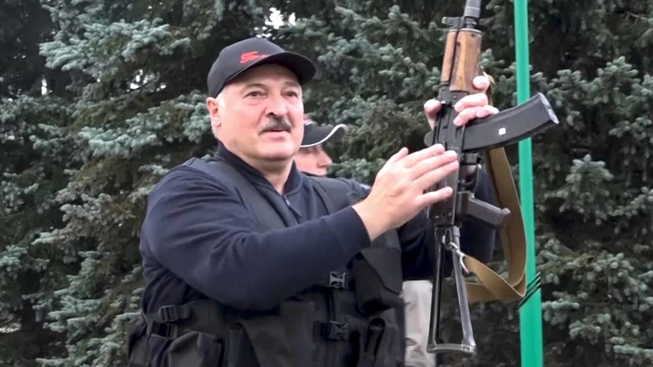 President Alexander Lukashenko brandishing a rifle near the Palace of Independence in Minsk, Sunday, as seen in video from state TV.