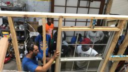 A group of volunteers complete training to work on house rennovations in New Orleans.