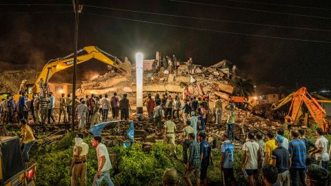 Rescue workers look for survivors after a building collapsed in India's western Maharashtra state. 