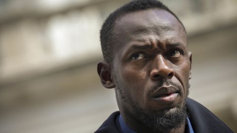 Track star and new Bolt pitchman Usain Bolt looks on during a press conference about the new Bolt Mobility scooter outside of New York City Hall, March 12, 2019 in New York City.