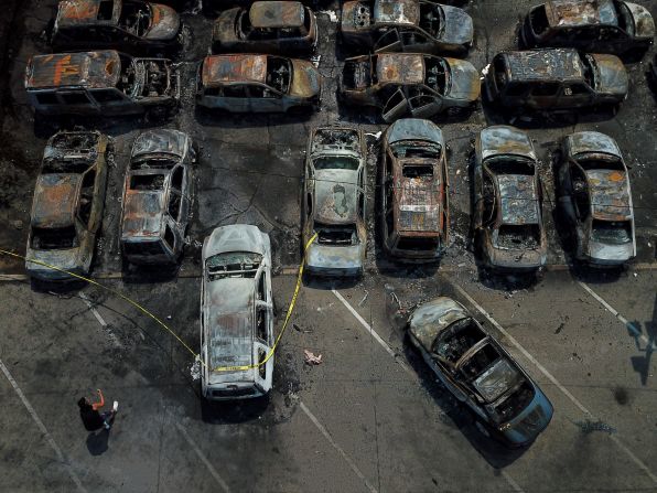 Vehicles that were burned during protests are seen in Kenosha on August 24.