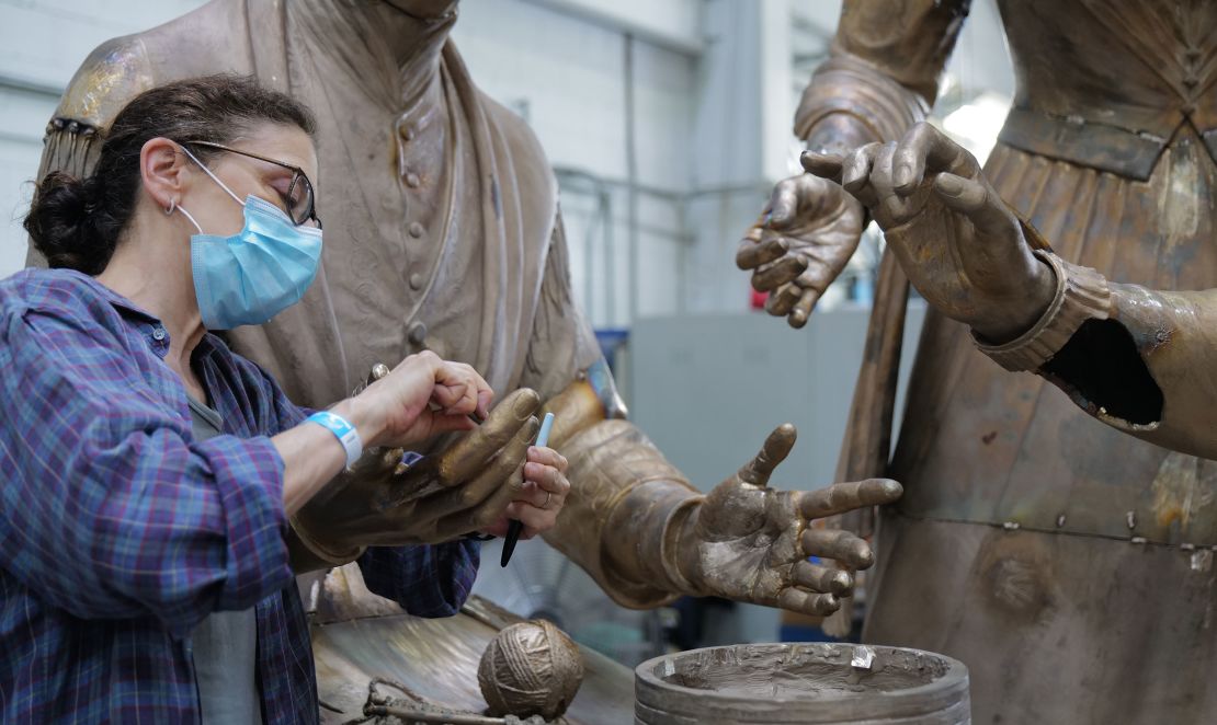 Meredith Bergmann works on the monument of women's rights pioneers ahead of its coming unveiling.