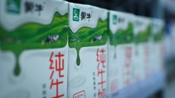 Mengniu milk products are seen on a shelf at a store in Beijing on June 24, 2019. (Photo by WANG Zhao / AFP)        (Photo credit should read WANG ZHAO/AFP via Getty Images)