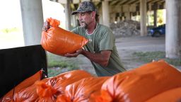 MORGAN CITY, LOUISIANA - AUGUST 24: Ken Allen fills sandbags as he prepares for the arrival of Tropical Storm Marco and possibly Hurricane Laura on August 24, 2020 in Morgan City , Louisiana. The Gulf Coast is expecting to see some impact from Tropical Storm Marco followed by Hurricane Laura.  (Photo by Joe Raedle/Getty Images)