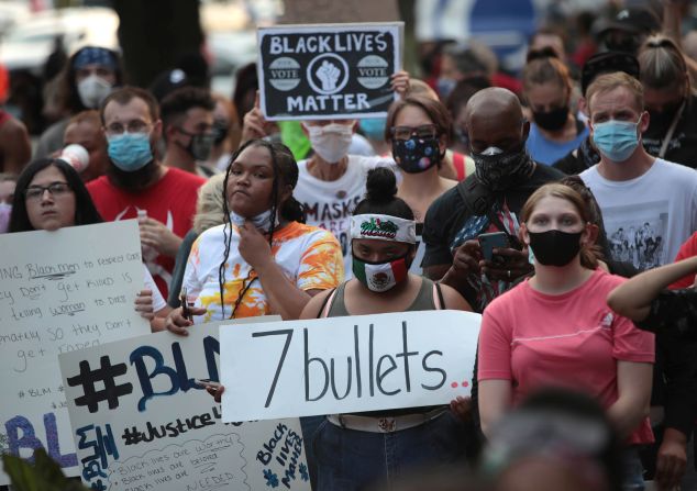 People gather in front of the Kenosha County Courthouse to protest on August 24.