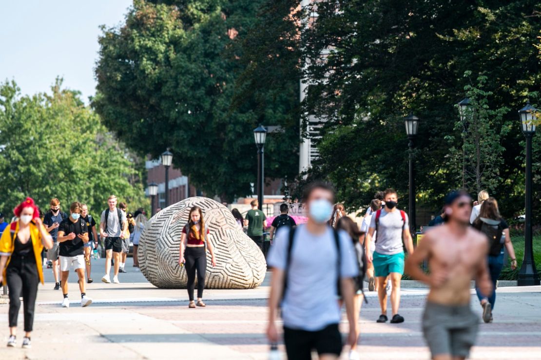 Students wear face masks Monday on the University of Iowa campus in Iowa City, Iowa.