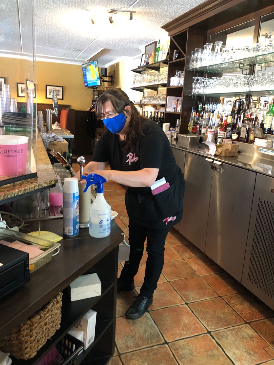 Nancy Page working at Philos Restaurant in Cornwall, which has relied on diners from the United States.