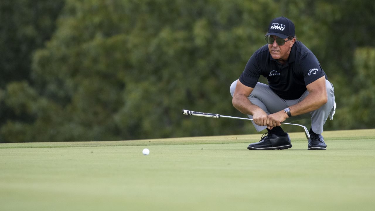 Mickelson lines up a putt on the 13th green during round one of the Charles Schwab Series.