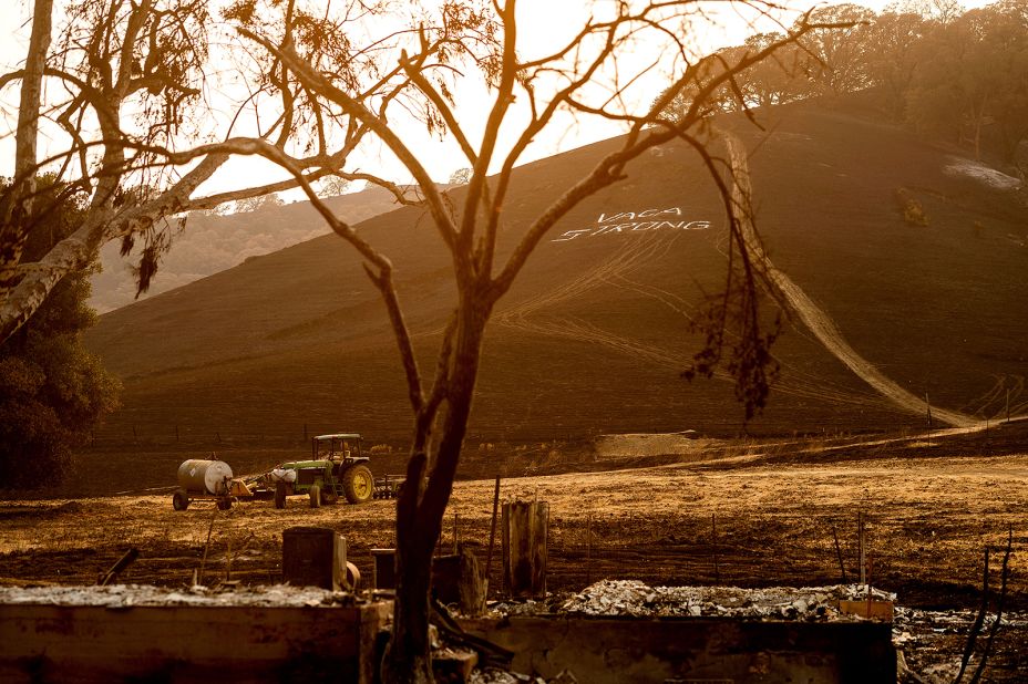 A sign reading "Vaca Strong" adorns a charred hillside in Vacaville, California, on August 24, 2020.