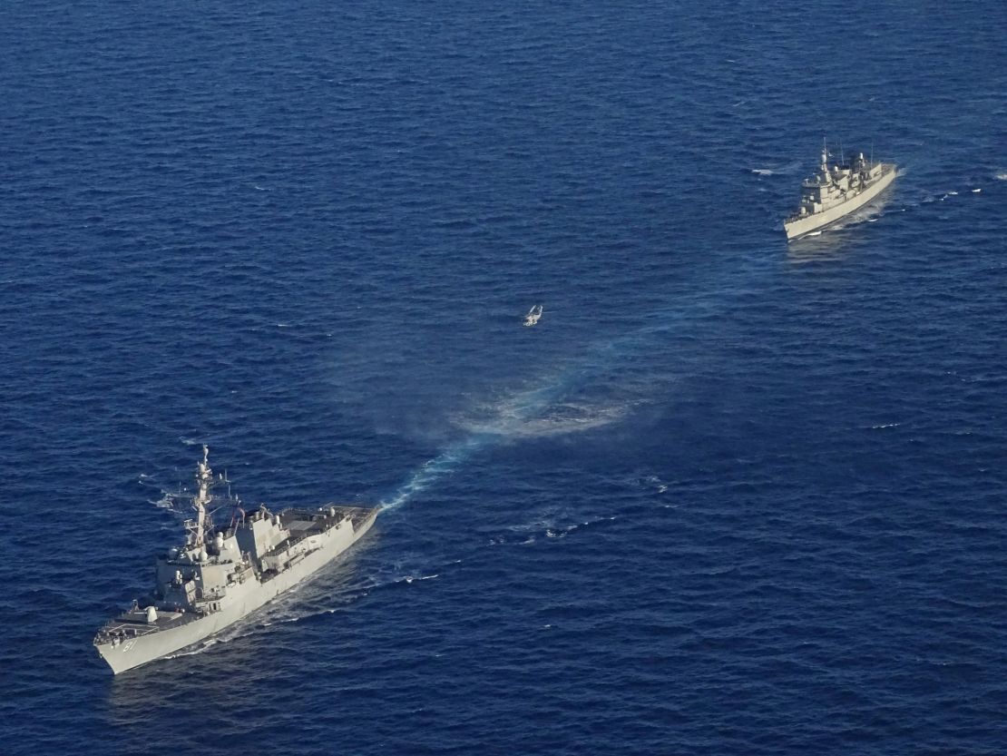 In this photo provided by the Greek National Defense Ministry, warships take part in a Greek-US military exercise south of the island of Crete, on Aug. 24, 2020. 